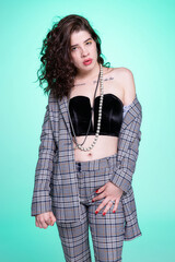 Dark hair caucasian girl on dark grey