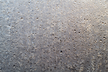 The winter frozen window is thawing. Texture