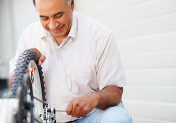 Man repairing bicycle