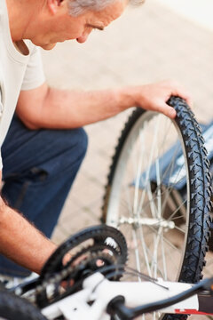 Man repairing bicycle