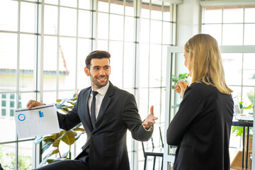 Caucasian and mixed race business man and woman wearing formal suit in the office 