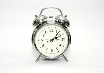 Vintage, analog alarm clock isolated on white background.