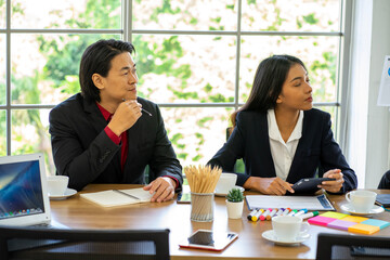 Caucasian and mixed race business man and woman wearing formal suit in the office 