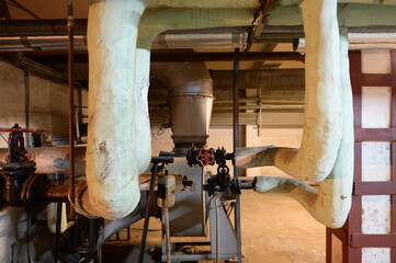 Heating pipes in the basement of the building