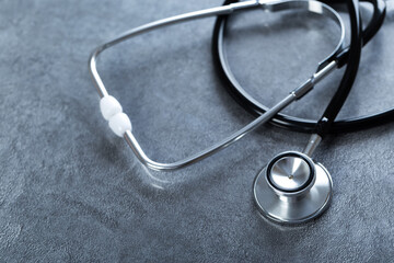 Black stethoscope for doctor diagnostic coronavirus disease, medical tool for health on blue...