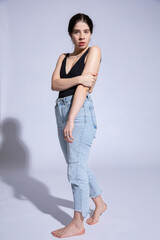 Dark hair caucasian girl on grey