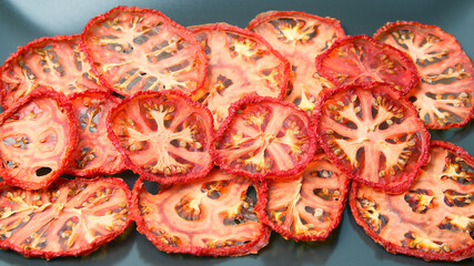 dried tomato slices on a plate. Vitamin vegetable food