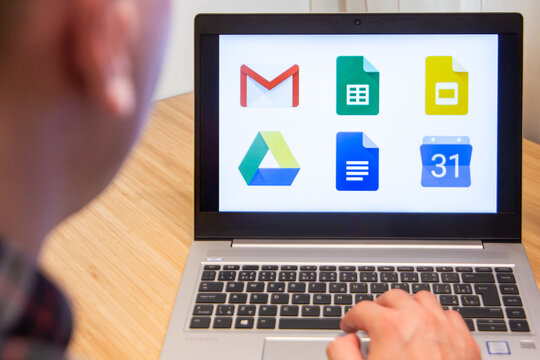 Google services is used by a man on the laptop. Microsoft customer used computer software. New product is tested by IT specialist. San Francisco, February 2020.