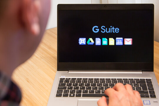 G suite is used by a man on the laptop. Microsoft customer used computer software. New product is tested by IT specialist. San Francisco, February 2020.