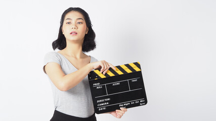 Teenage girl or woman wearing braces and contact lenses.Her hand's holding black clapper board or movie slate use in video production ,film, cinema industry on white background.