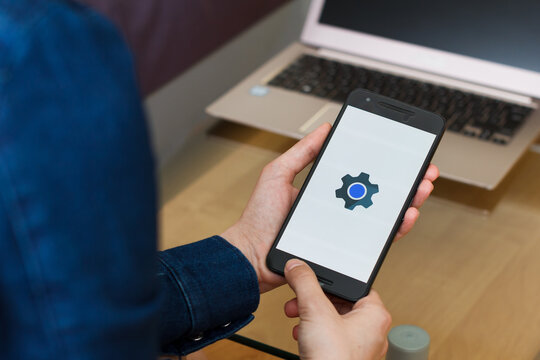 SAN FRANCISCO, US - 22 April 2019: Close up to female hands holding smartphone using Android System WebView application, San Francisco, California, USA. An illustrative editorial image