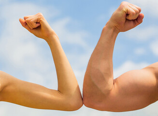 Fototapeta na wymiar Sporty man and woman. Muscular arm vs weak hand. Vs, fight hard. Competition, strength comparison. Rivalry concept. Rivalry, vs, challenge, strength comparison