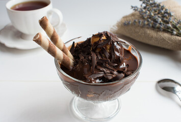 Delicious profiteroles with chocolate sauce and vanilla cream.