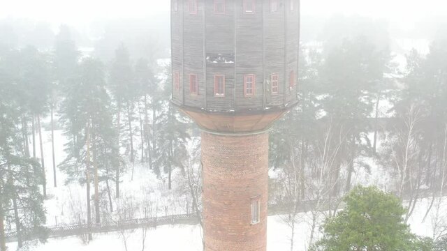 view of the old water tower standing by the road