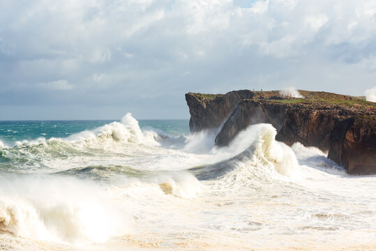 Spectacular scenery of foamy sea waving over rough rocky cliff on sunny day in Bufones de Llames Pr&radic;&ne;a in Spain