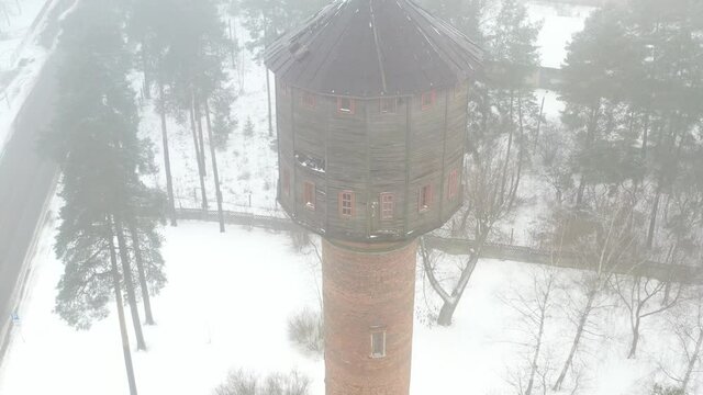 view of the old water tower standing by the road