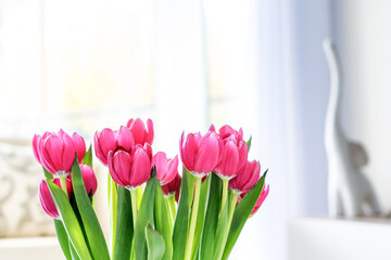 Pink tulips in a contemporary and light living room interior #3