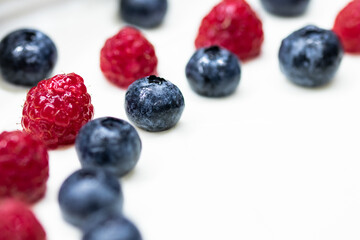 Cheese cake strawberry and raspberry on creamy white flat layer. Cooking at home. Recipe and cooking activity with pastry and bakery. Cheesecake with fruits