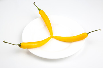 yellow hot chili on a plate. Pepper. Vegetable vitamin food.