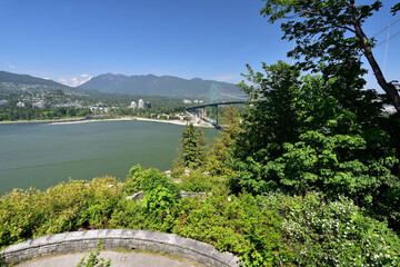 Fototapeta premium VANCOUVER, BRITISH COLUMBIA, CANADA, MAY 31, 2019: Lions Gate Bridge view from Prospect Point in Stanley Park, Vancouver, Canada