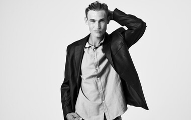 portrait of sexy man in buttoned jacket and shirt business finance model