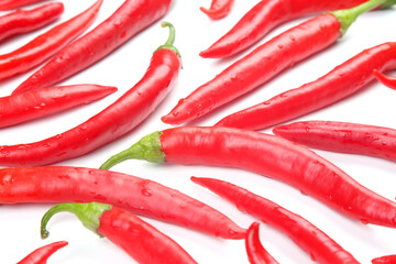 Red hot chili peppers on a white background. Vitamin vegetable food