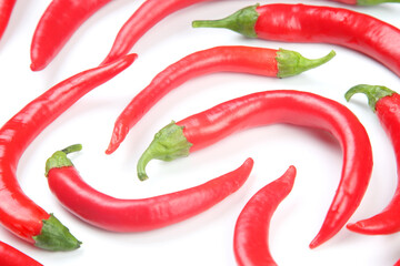 Red hot chili peppers on a white background. food figures. Vitamin vegetable food