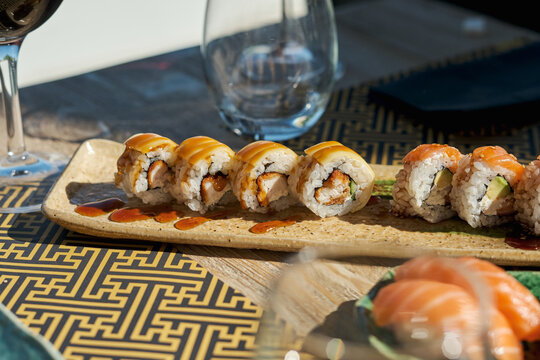 From above sushi and rolls on table in Asian restaurant