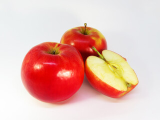 Nice red apples and half an apple on white background.   