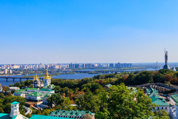 View of Kiev Pechersk Lavra (Kiev Monastery of the Caves),  Motherland Monument and the Dnieper river in Ukraine. View from Great Lavra Bell Tower
