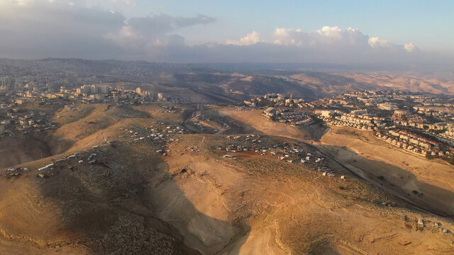 Israel and Palestine town living side by side, aerial view
maale adumim and al-eizariya town aerial view, judea desert December 2020
