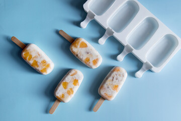 Homemade ice cream with fruit pieces and silicone mold