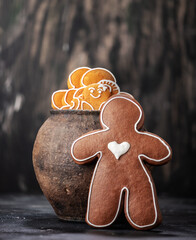 Collection of various gingerbread men in a pot