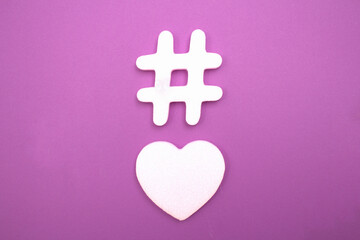 Hashtag and heart shape as social network symbols.