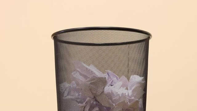 Empty Office Trash Basket Filles Up With Waste Papers. Stop Motion Footage.