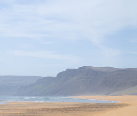 Fototapeta na wymiar Mountains dune. Blue sky and blue ocean. 