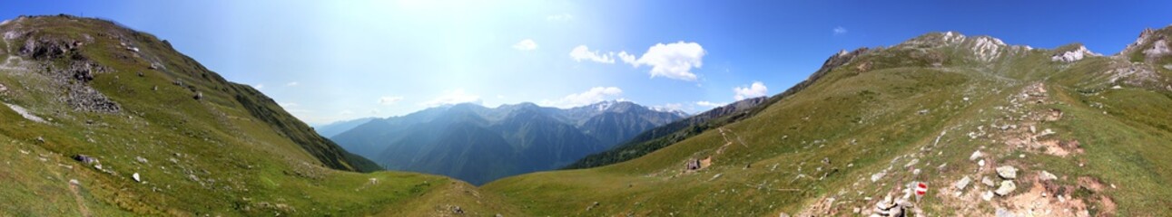 Panoramic view of Martell valley and Göflaner Schartl pass on a mountain ridge in the Alps in...