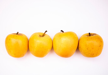 Golden delicious apples, color yellow background