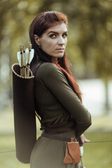Portrait of a lovely woman with an ancient quiver with arrows on her back