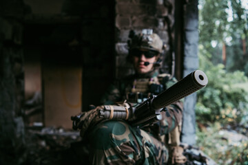 Fototapeta premium Soldier preparing tactical gear for action battle
