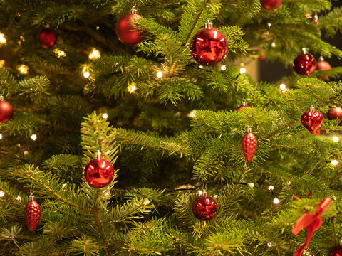 Christmas tree with red balls and red decoration.