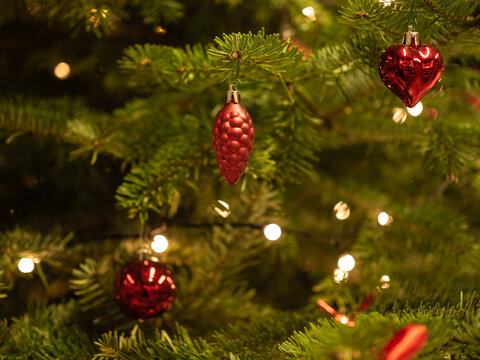 Christmas tree with red balls and red decoration.