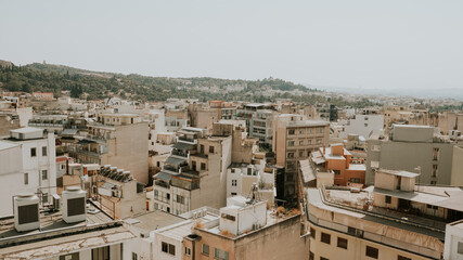Beautiful historic city of Athens during sunny day and mountains in background,Greece.