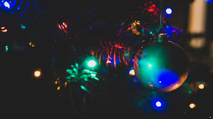 Christmas decorations at christmas tree with blurred RGB lights - obrazy, fototapety, plakaty