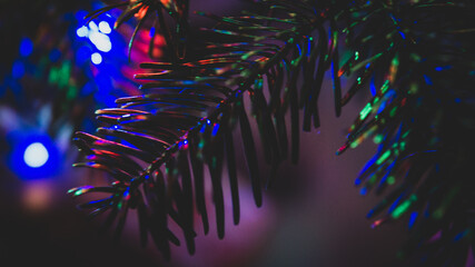 Decoration at christmas tree with blurred RGB lights