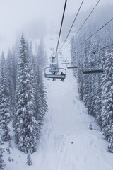 Fototapeta na wymiar A ski lift in a cold and wintery Vail, Colorado, USA