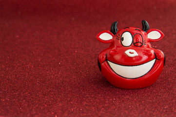 Cheerful bull smiling on red background.Symbol of 2021. New year 2021 concept. Place for your text.