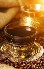 Silver coffee cup and golden cezve.