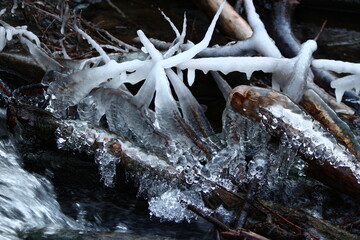 Beautiful ice build-up on the stream in winter