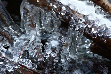Beautiful ice build-up on the stream in winter